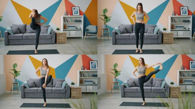 穿着紧身裤和单腿顶部平衡的漂亮女人在家练习瑜伽