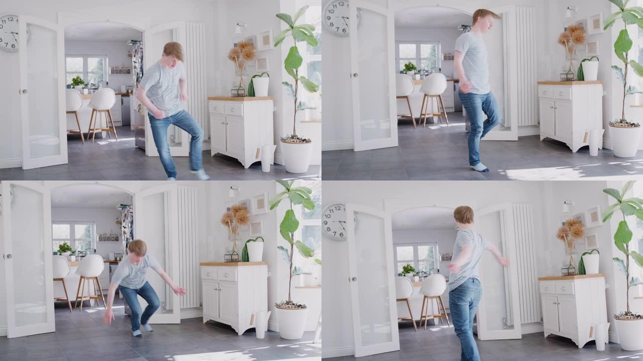 年轻的唐斯综合症男子在家里跳舞很开心