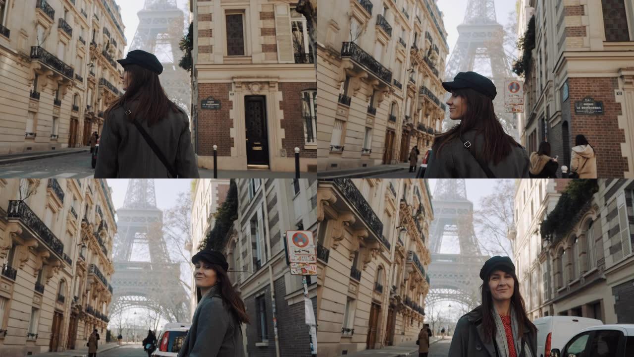 摄像机跟随快乐美丽微笑的旅游女人在浪漫的巴黎度假慢动作中走向埃菲尔铁塔广场。