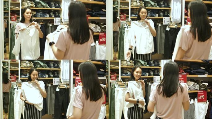 亚洲妇女在商店里试穿衣服