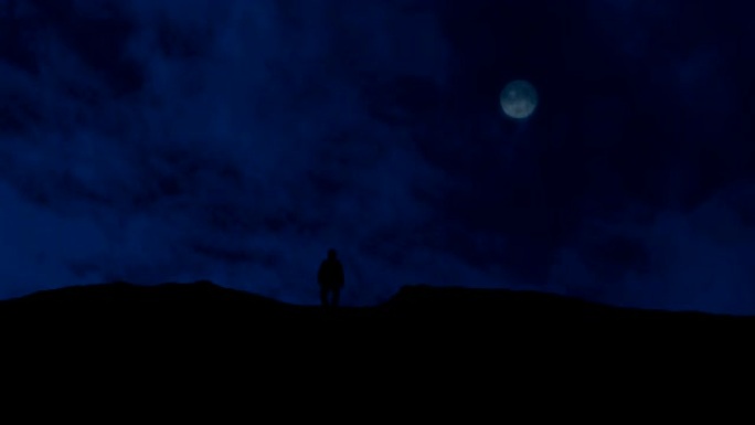 人类越过山丘，月亮在上面
