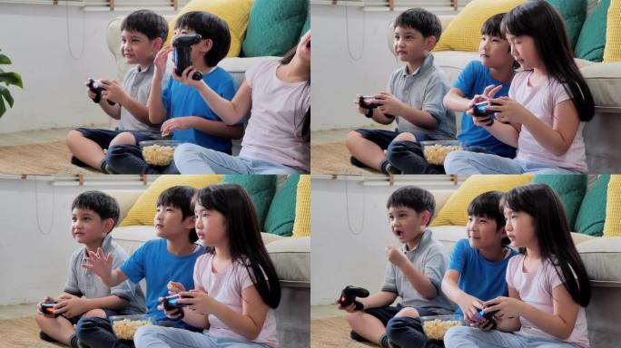 一群孩子在家玩电子游戏，快乐有趣。早期教育和学习。教育，儿童，技术，科学和人的观念。