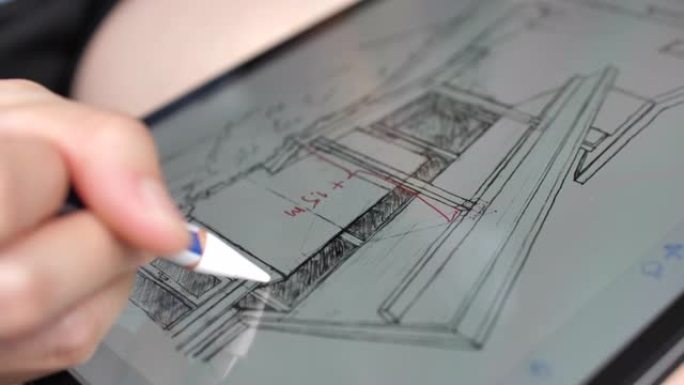 建筑师在数字平板电脑上绘图