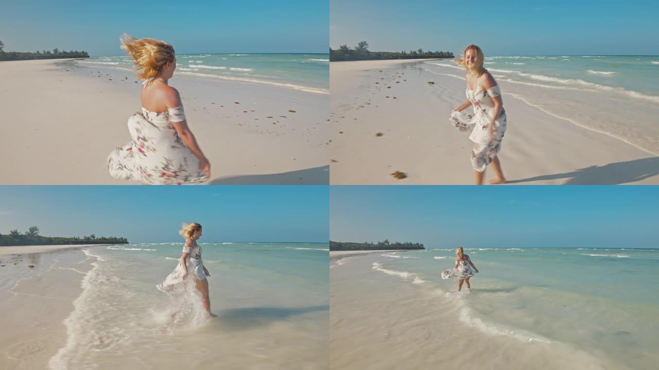 在美丽的海滩上奔跑的SLO MO欣喜若狂的女人