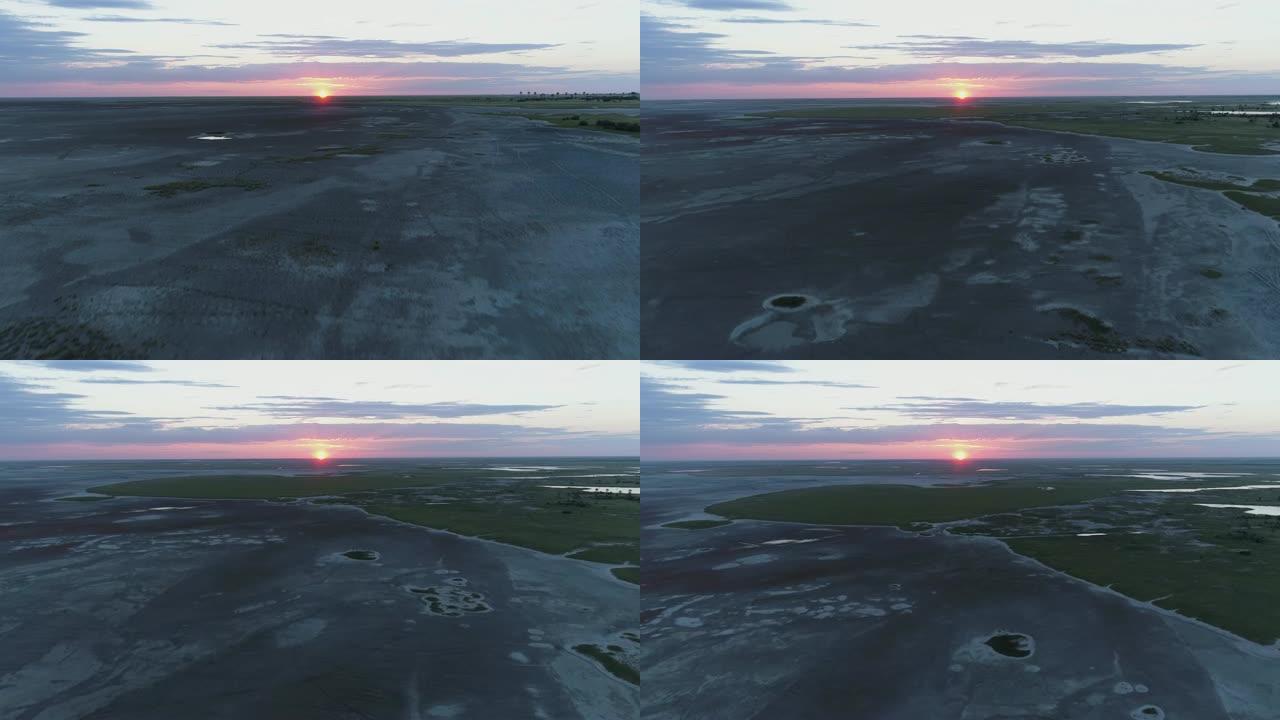 博茨瓦纳Makgadikgadi平底锅上的4k高空中倾斜太阳落山视图