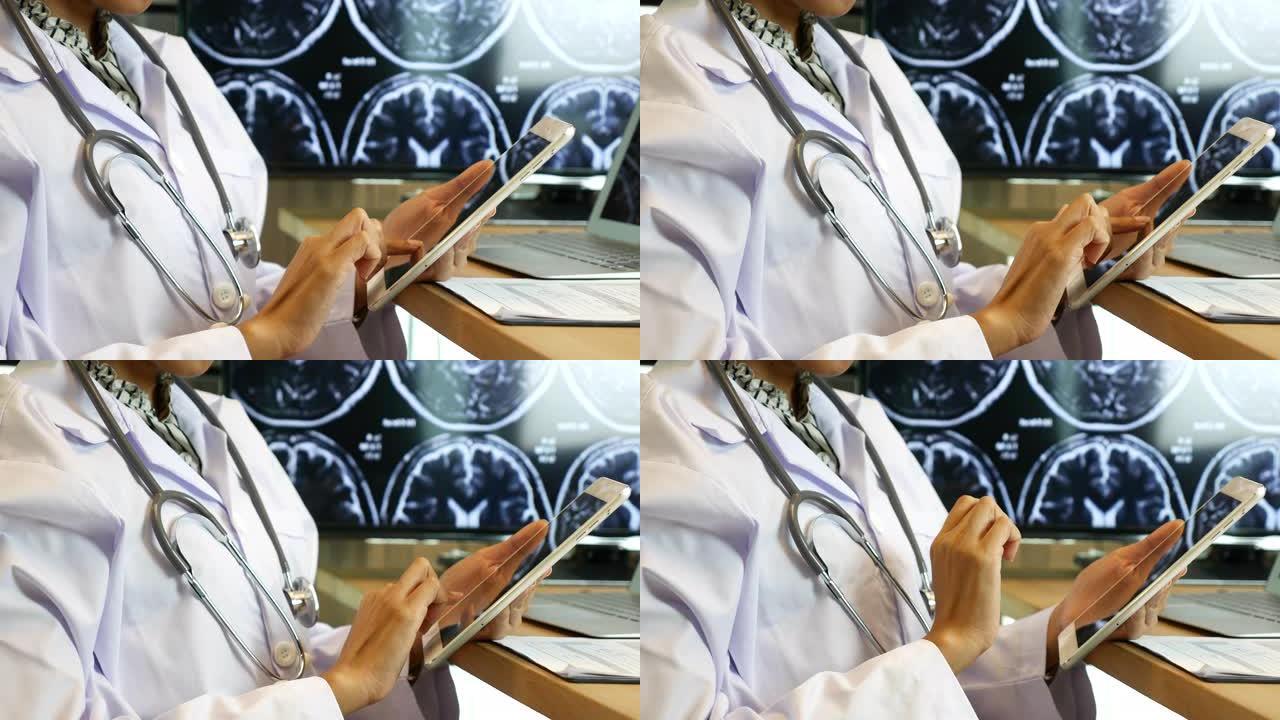 在数字平板电脑工作的医生，特写镜头