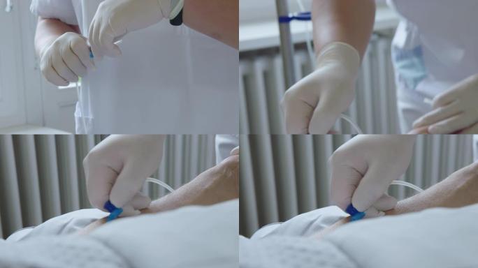 护士将静脉注射针插入病人的手