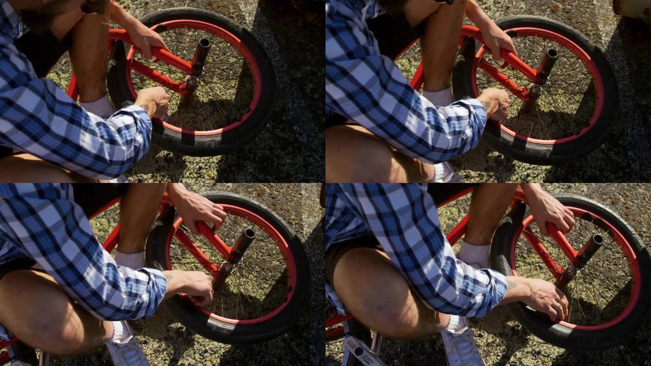 BMX骑手修理轮修链条调整骑行者