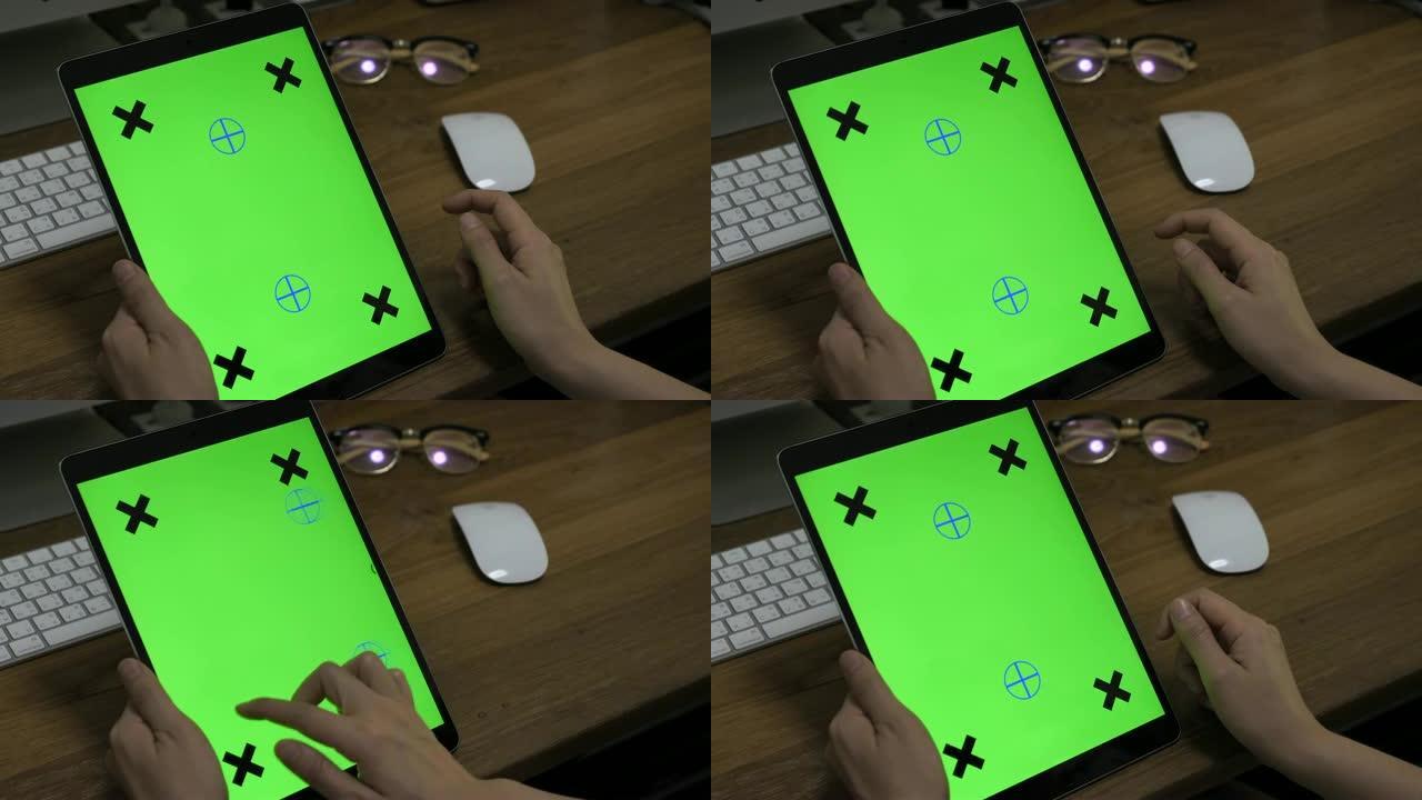 在数字平板电脑上使用绿屏模拟的特写手