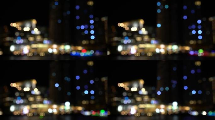 4k镜头模糊的散焦城市场景闪烁闪烁的灯光在夜间呈现，背景为bokeh，以新年快乐和派对概念庆祝
