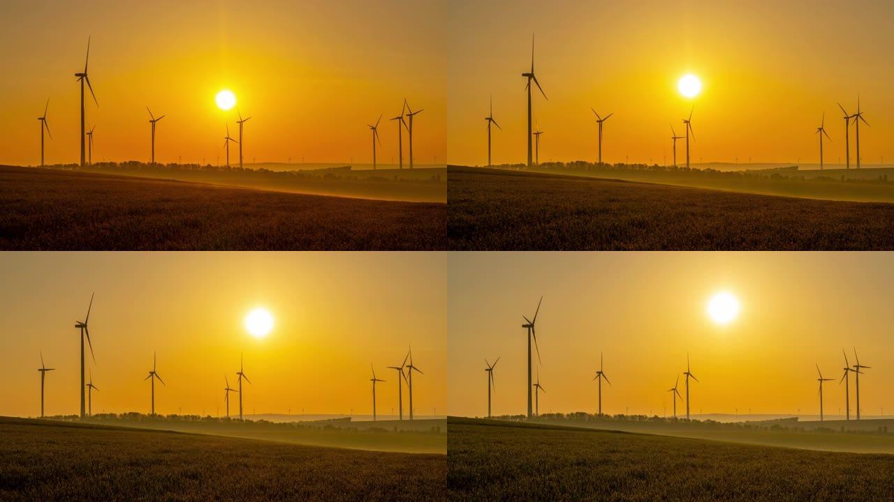 T/L时间翘曲日出在农村旋转的风力涡轮机的延时拍摄