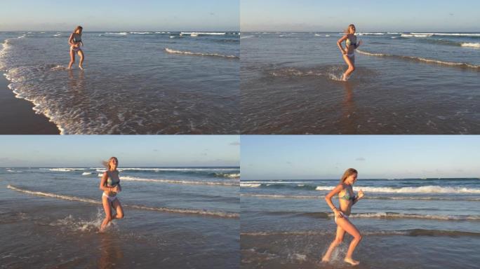南非海滩浅水中奔跑的美丽年轻女子的4k慢动作视图