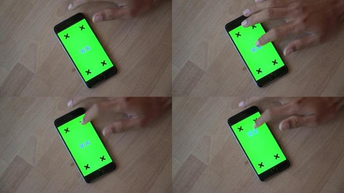 使用绿屏智能手机的特写镜头