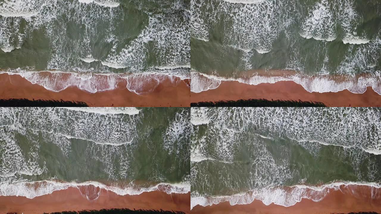 暴风雨前海滩和沙滩上海浪的鸟瞰图