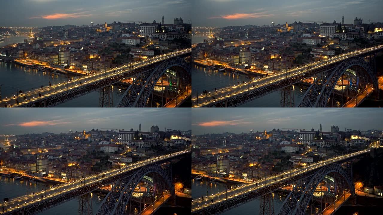 人们走过葡萄牙波尔图的Dom Luis I桥。平移夜景。4K, UHD