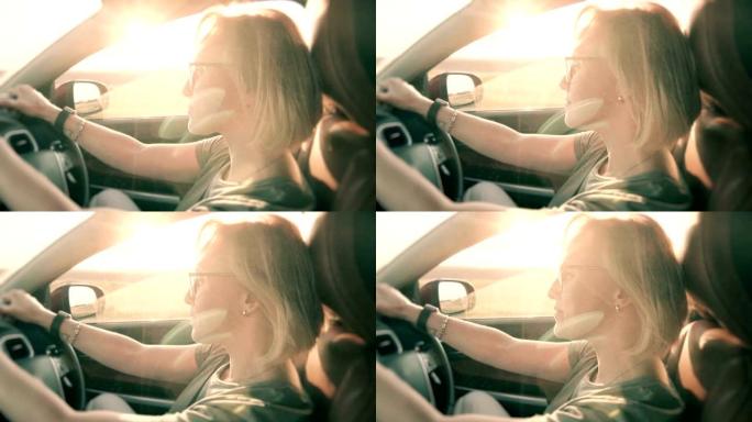 小资女人在日落时驾驶汽车