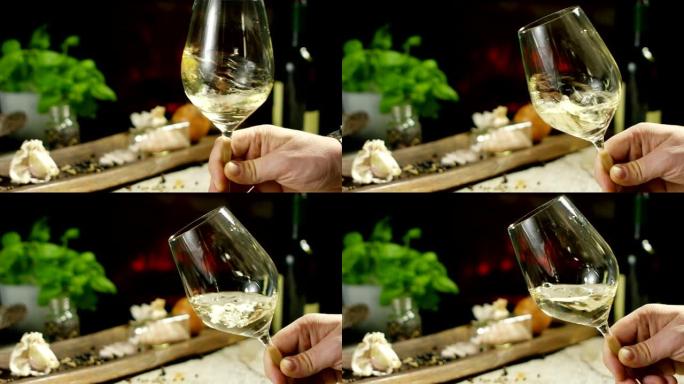 葡萄园中的侍酒师以慢动作将意大利白葡萄酒倒入玻璃杯中