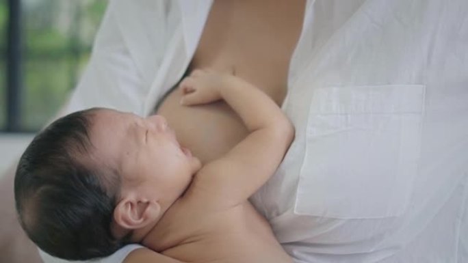 婴儿睡在母亲怀里的特写镜头，慢动作
