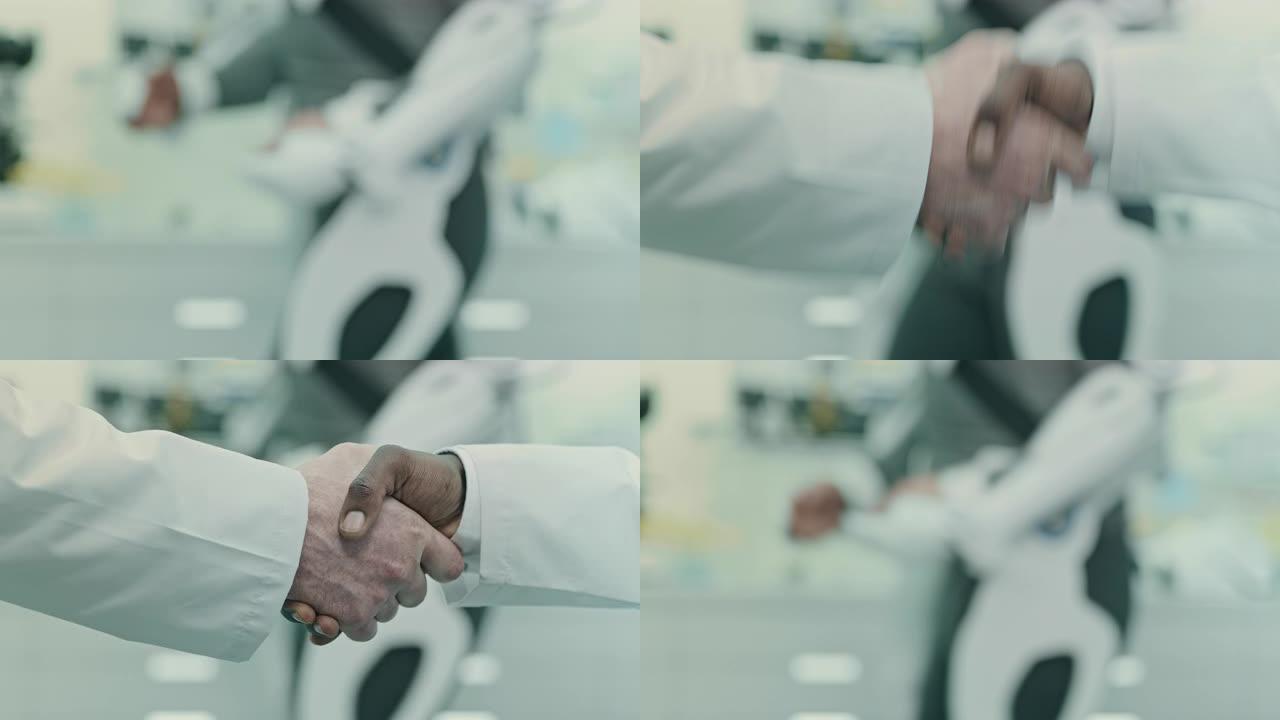 科学家在实验室握手。
