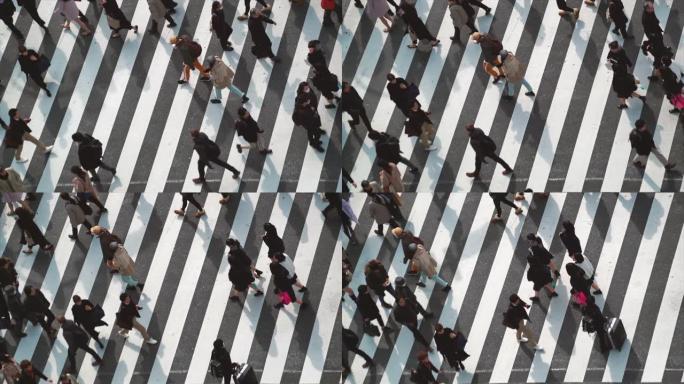 日本东京都涩谷区交通路口高峰时段的4k慢动作镜头和行人步行天桥。日本文化和购物区概念