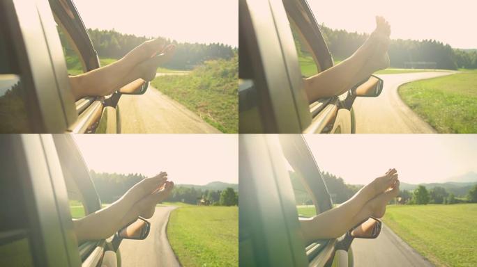 镜头耀斑: 面目全非的女孩用脚穿过车窗开车。