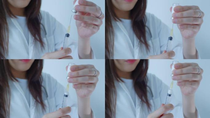 亚洲女医生准备注射器特写慢动作