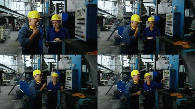 向员工展示工厂机器的女人
