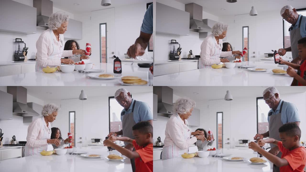 祖父母在厨房和孙子一起吃煎饼
