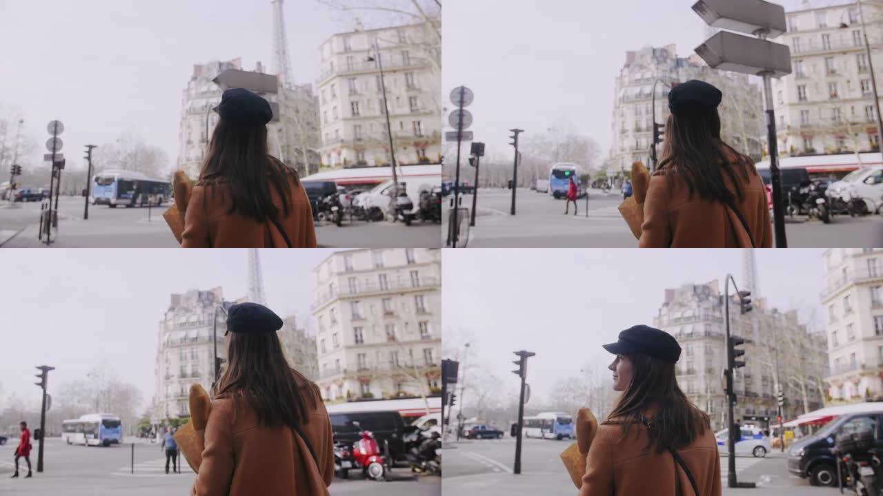 镜头跟随美丽的快乐食物博主女人带着购物纸袋慢动作走在巴黎街上。