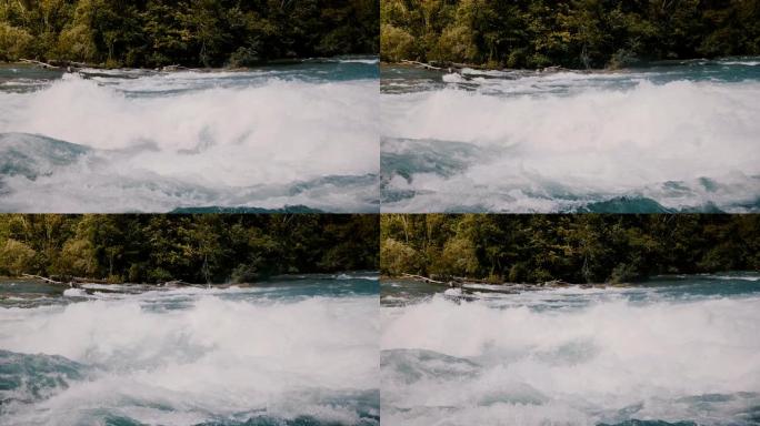 在危险的快速尼亚加拉河汹涌的水域，快速的白水波浪和岸上的树木上拍摄泡沫的特写镜头。