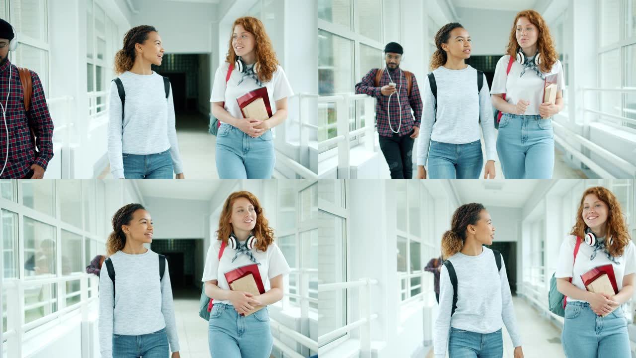 女学生在学校大厅里用书走路的慢动作