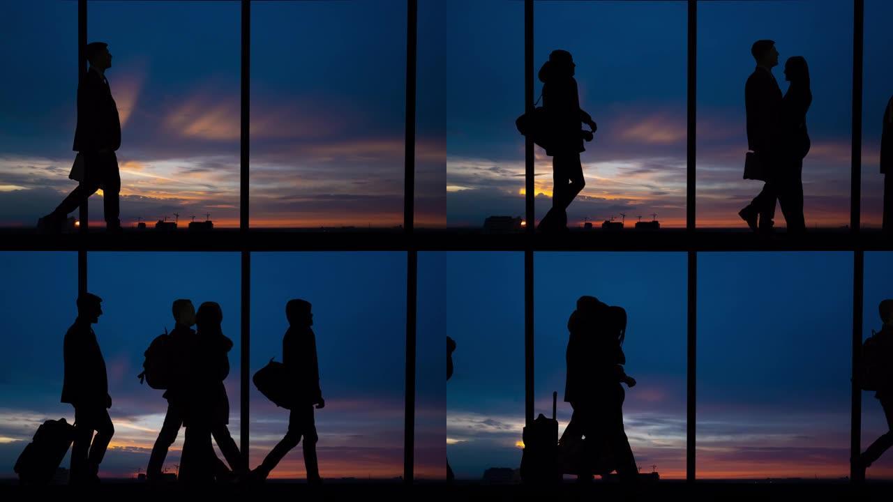 在机场窗户附近接吻的夫妇和步行的人的剪影