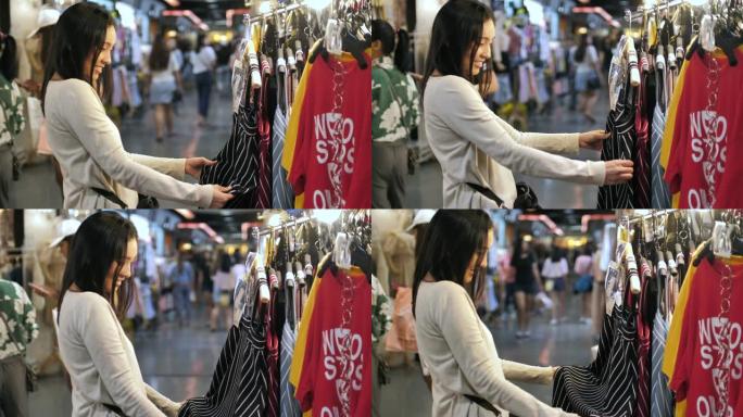 亚洲妇女在街头市场购物