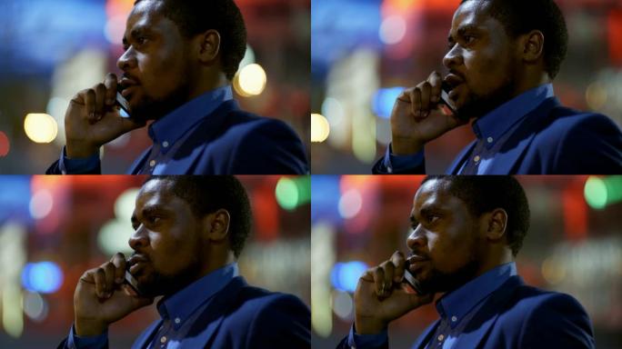 优雅的非洲男子在手机上聊天