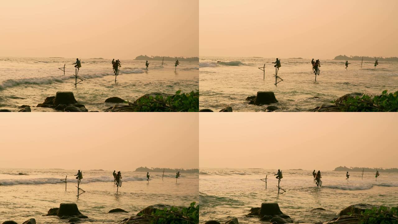 斯里兰卡日落时分，渔民从海上的哨所捕鱼
