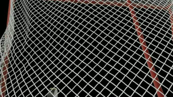 冰球在黑底绿屏上以慢动作飞入球门网。特写目标时刻。美丽的3d动画与阿尔法蒙版。运动概念。