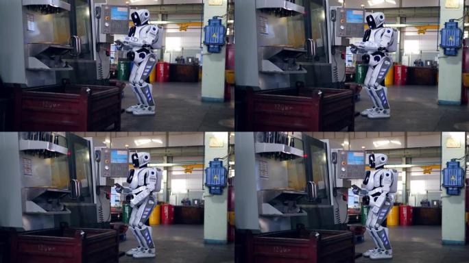 一个机器人在工厂使用平板电脑时检查机器。