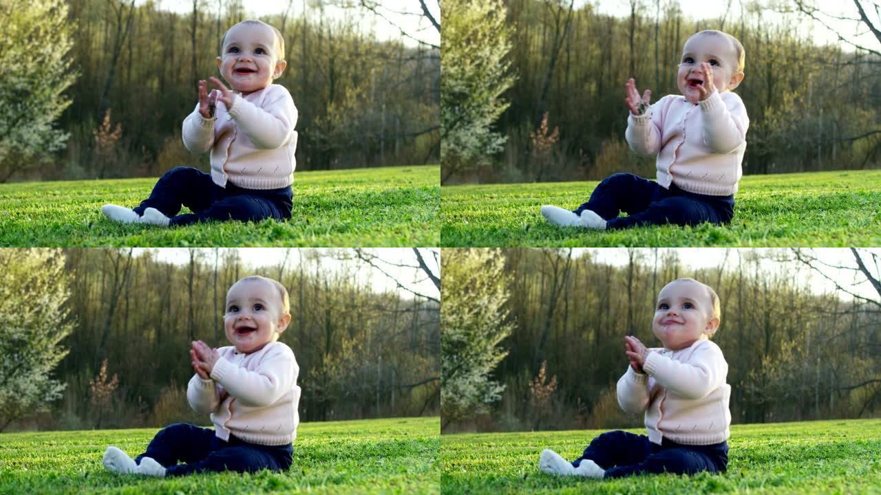 一个可爱的小宝宝看着相机，很高兴宝宝环顾四周，用手臂玩耍