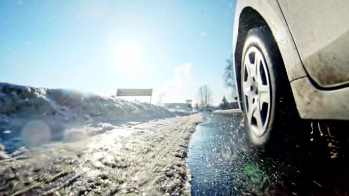 汽车在雪地上行驶冬季轮胎特写