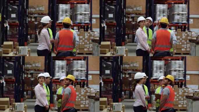 在会议上讨论业务时，仓库的商务人员和男主管团队正在看货架