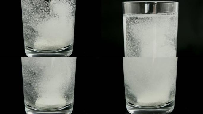 CU手滴抗酸剂片剂溶解在黑色背景下的饮用水中