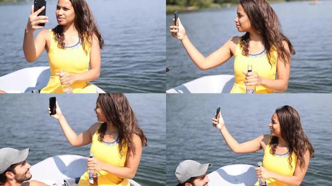 女人在湖中使用智能手机在划艇上拍摄