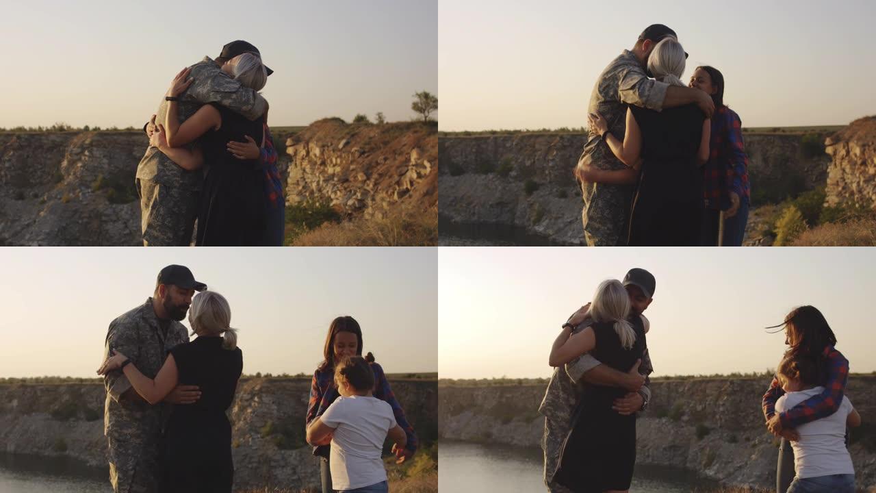 士兵拥抱他的妻子和女儿