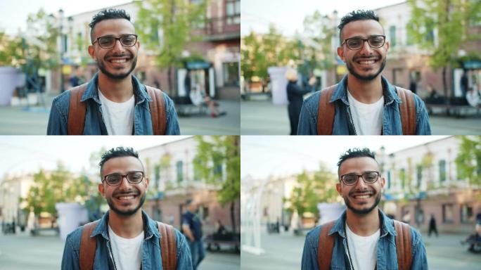 好看的学生肖像中东家伙在街上微笑