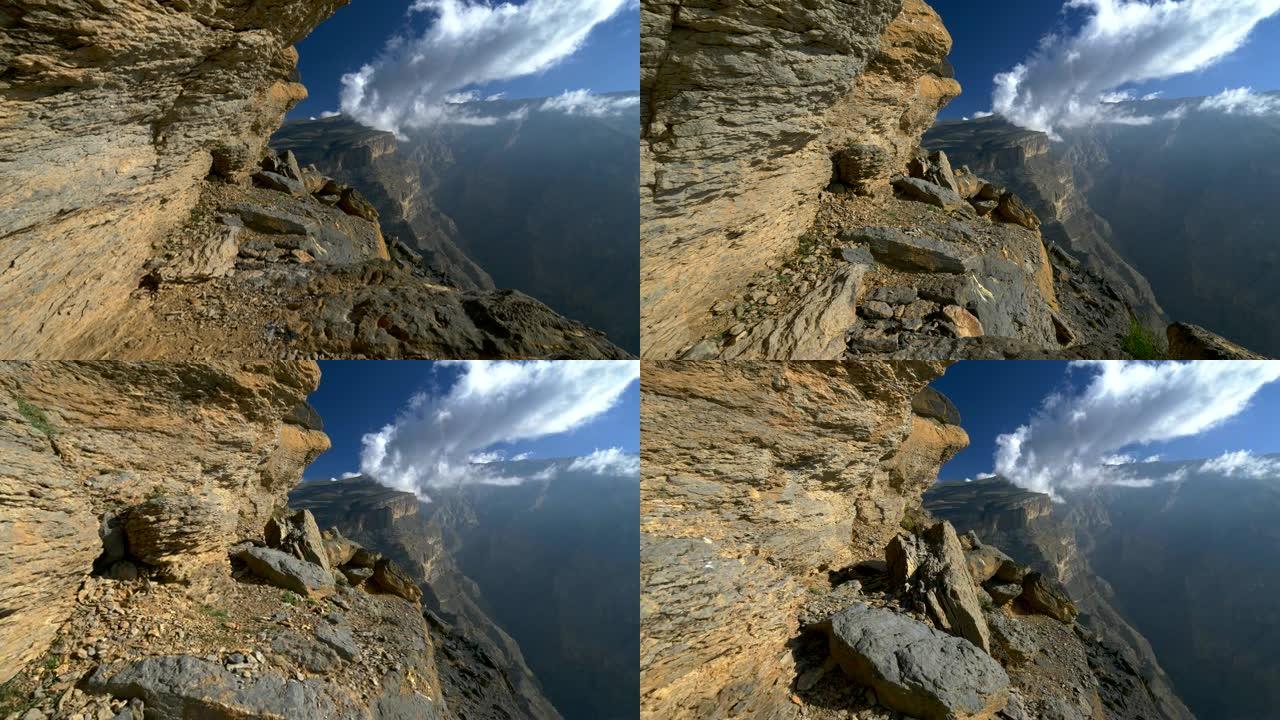 杰贝沙姆斯山 (太阳山)，阿曼。摄像机沿着阿拉伯半岛杰贝沙姆斯山脉峡谷的山路移动。4K