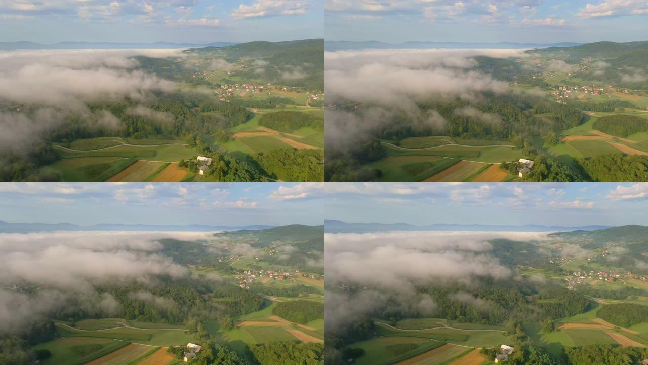 晨雾中的空中乡村唯美村庄晴朗天气云层