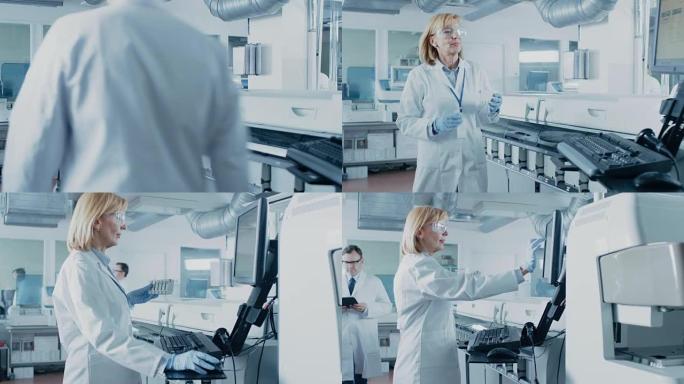 在实验室中，女科学家从医疗设备中取出带有血液样本的试管，并用个人计算机分析数据。研究人员团队在制药实