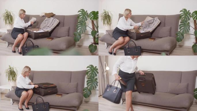 女商人为工作旅行打包行李箱