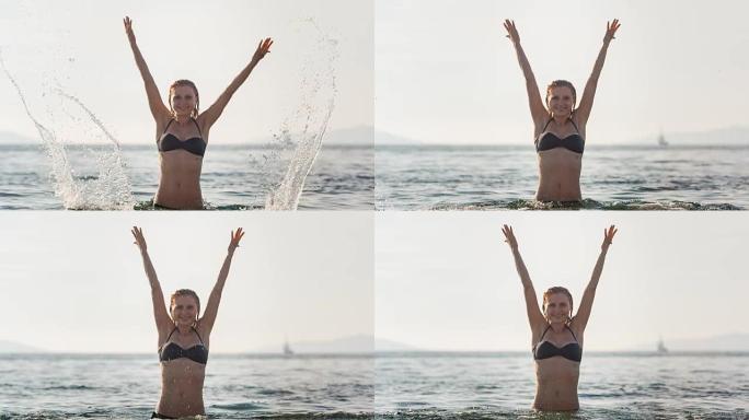 年轻女子在海里泼水