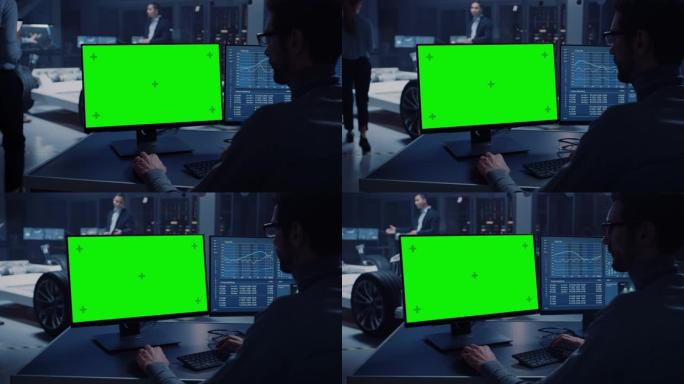 专业工程师在带有绿屏模型的计算机上工作，并在高科技开发实验室中测试带有车轮，电池和发动机的电动汽车底